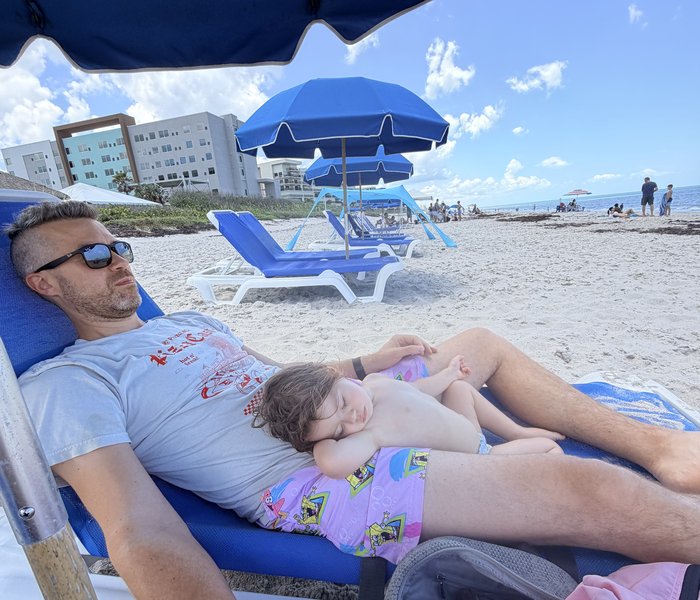 kids asleep on shoulders, port day